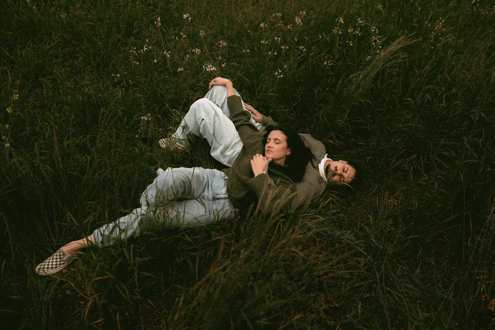 A couple in a wildflower field, warm natural edit